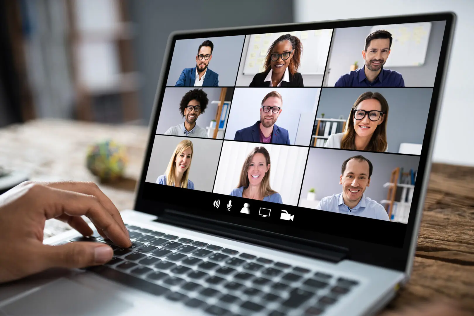 video conference screen with nine individuals